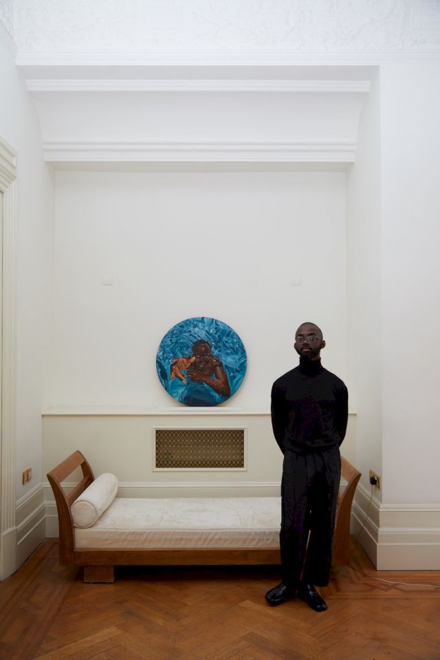 Joseph captured at home in London. Got You by Richard Mensah in the background, Courtesy of The Terra Collection of African Contemporary Art