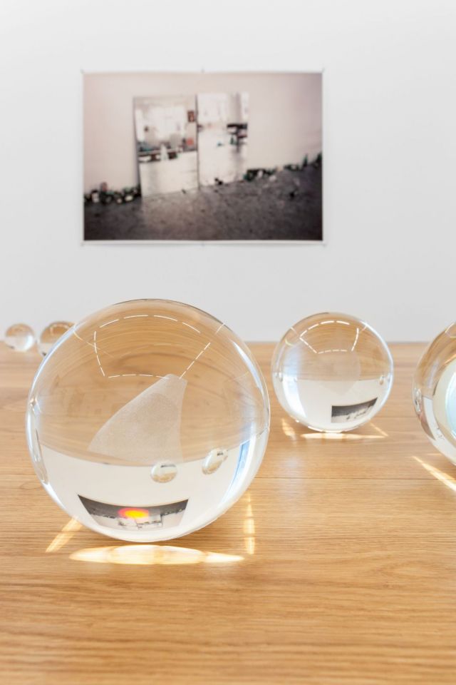 Installation view / RYAN GANDER, A sheet of paper on which I was about to draw, as it slipped from my table and fell to the floor, 2008; Wolfgang Tillmans, After party (c), 2002. Photo: Bruno Lopes