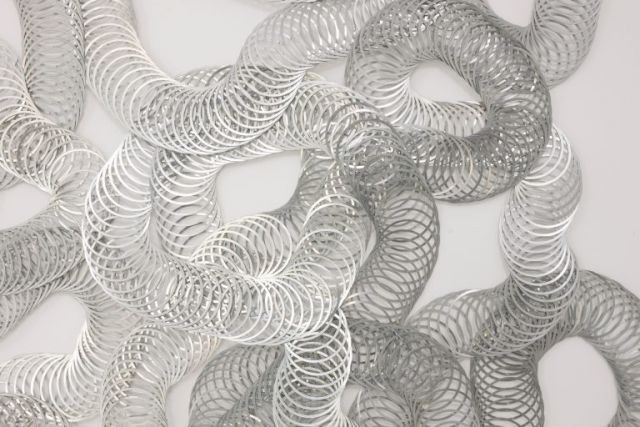 TARA DONOVAN, Untitled (Slinkies), 2015. Courtesy Jupiter Artland, Photo: © Ruth Clark