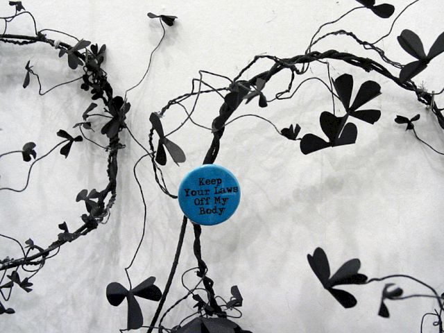 ANDREA BOWERS, Political Slogans and Flower Magic: Keep your laws off my body!