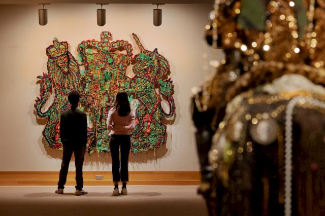 Hew Locke,'Veni, Vidi, Vici (Queen's coat of arms)', 2004. Installation view of Hew Locke: Passages at the Yale Center for British Art, 2025. Artwork courtesy the David and Indrė Roberts Collection. Image © Yale Center for British Art
